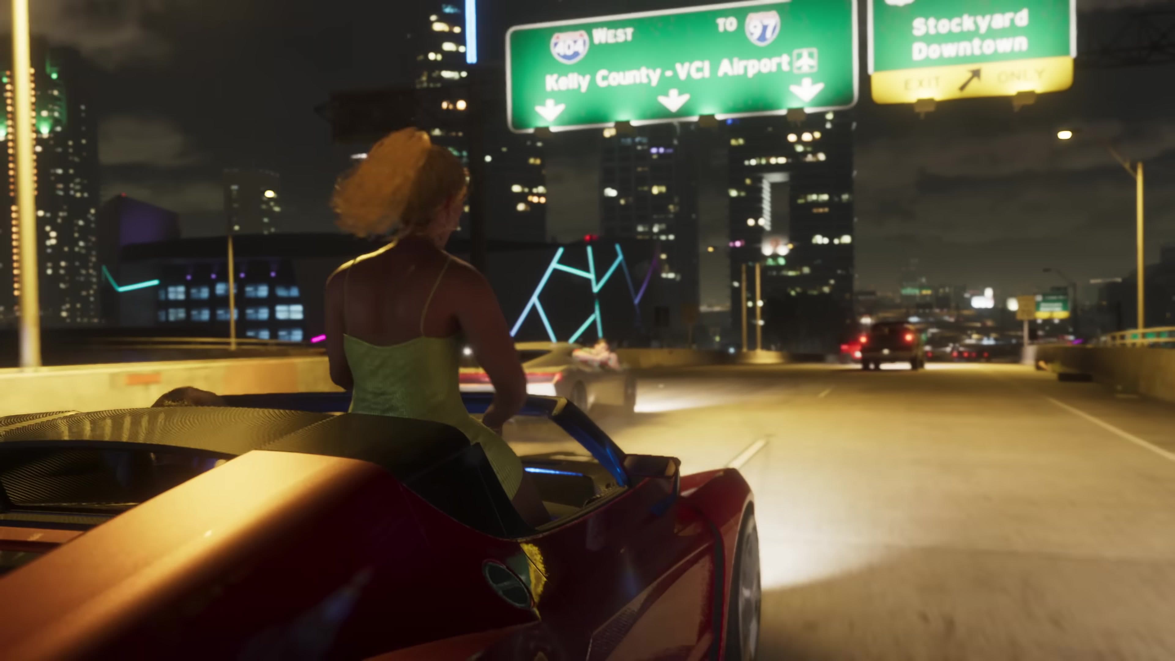 Convertible driving through a neon-lit city at night