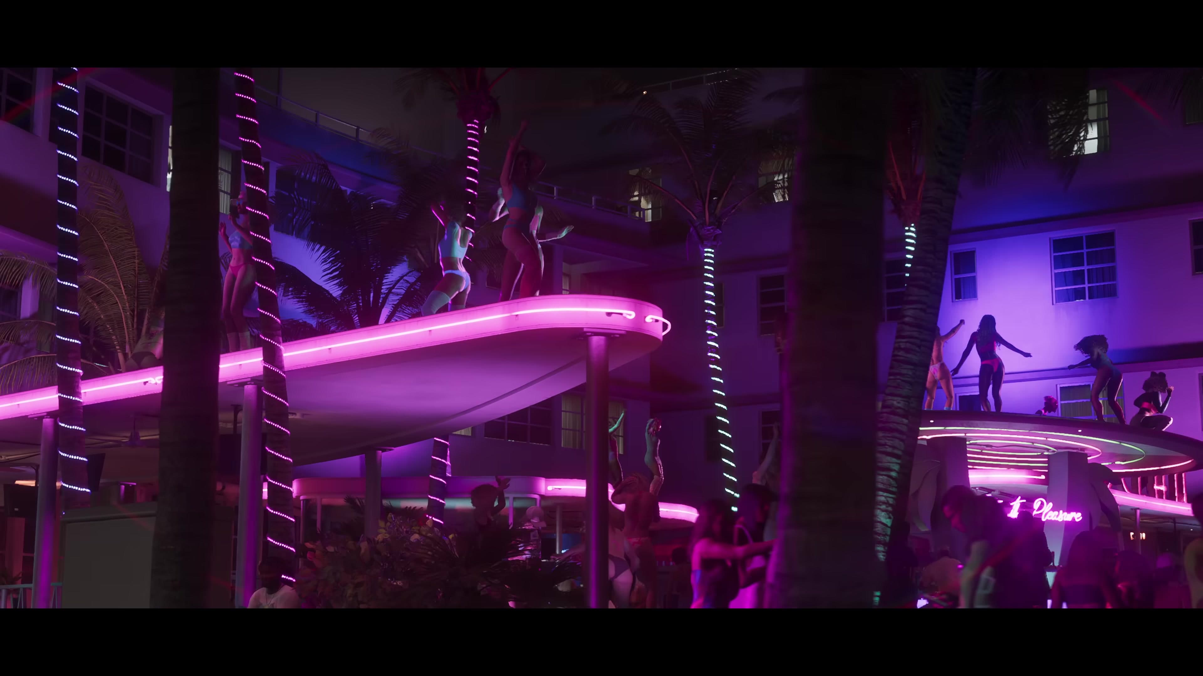 People dancing on neon-lit rooftops at night